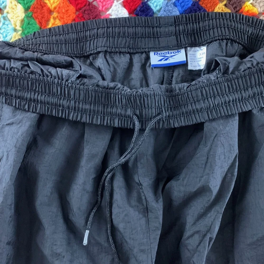 Vintage 90s Reebok Nylon Embroidered Logo Zip Leg Track Pants Joggers Sw…